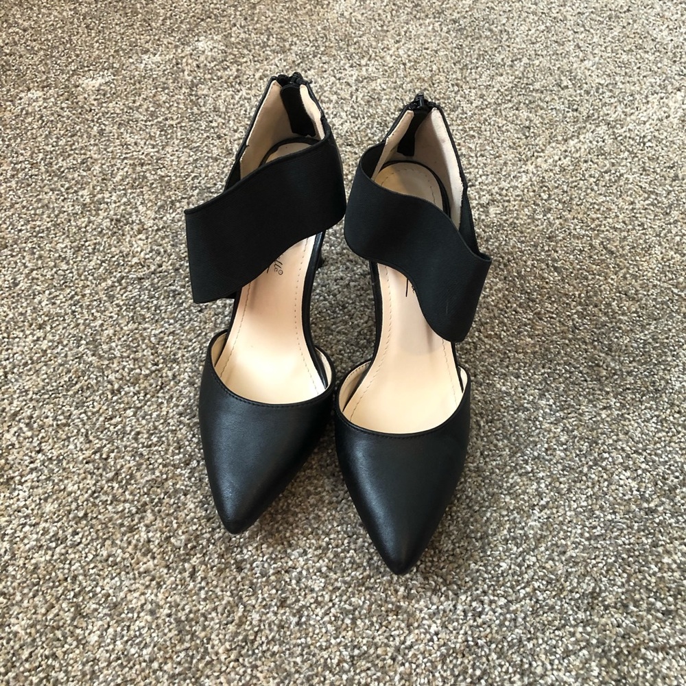 Black pointed toe heels
